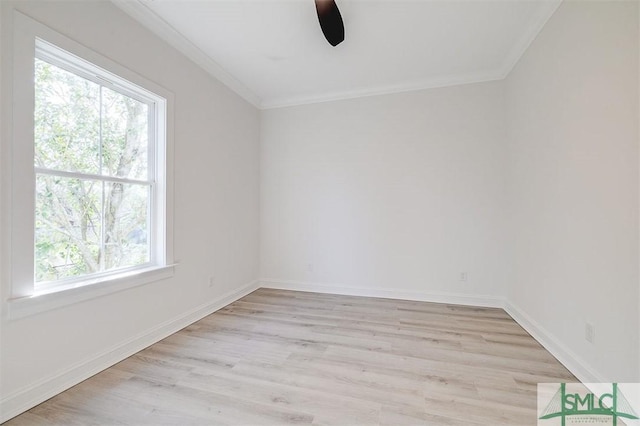 unfurnished room with a ceiling fan, baseboards, light wood finished floors, and ornamental molding