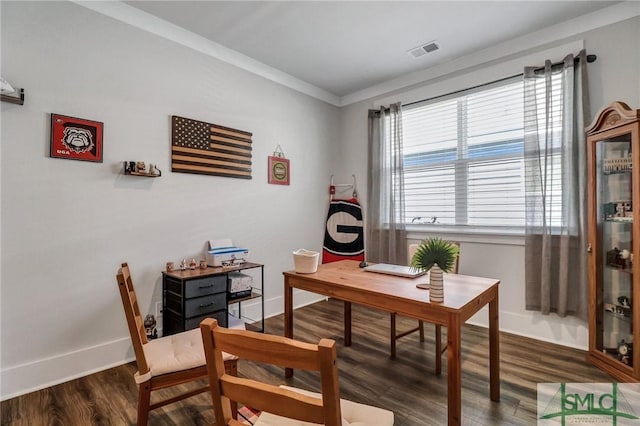 office area featuring visible vents, baseboards, dark wood finished floors, and ornamental molding