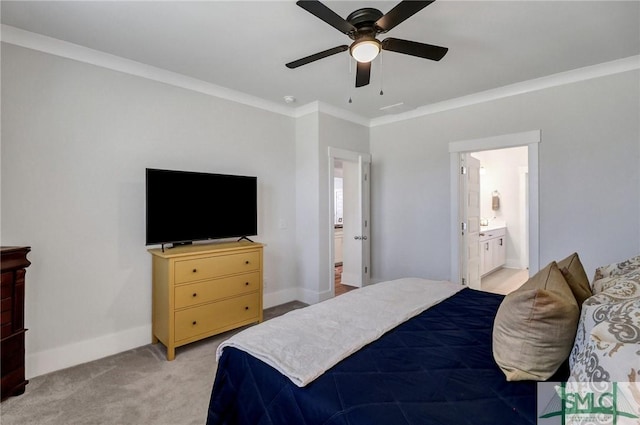 bedroom with light carpet, ensuite bath, crown molding, and baseboards