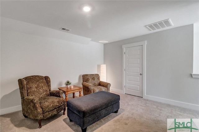 living area with carpet flooring, baseboards, and visible vents