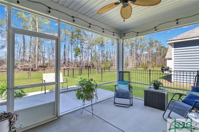 sunroom featuring a wealth of natural light and a ceiling fan