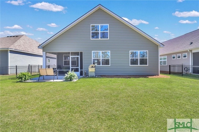 back of house with a patio area, a lawn, a fenced backyard, and a sunroom