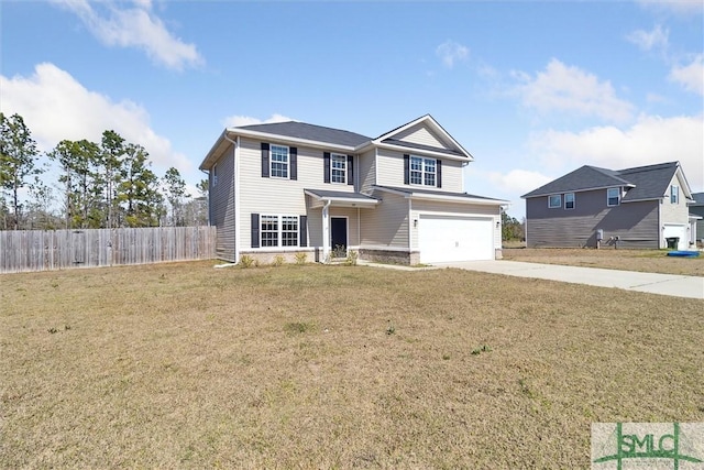 traditional-style house with a front yard, fence, a garage, and driveway