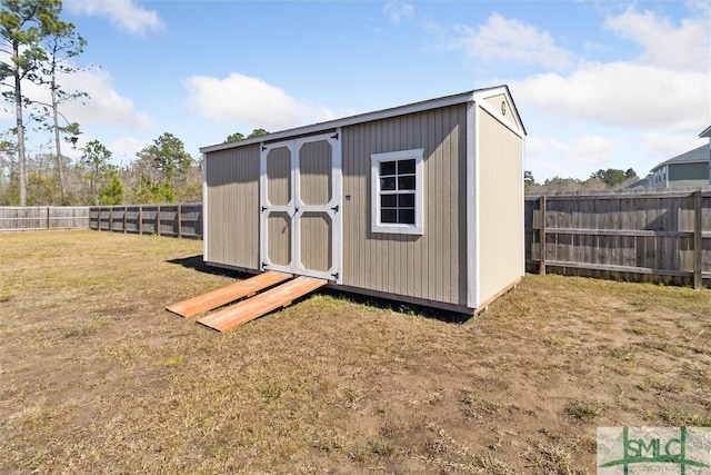 view of shed with a fenced backyard