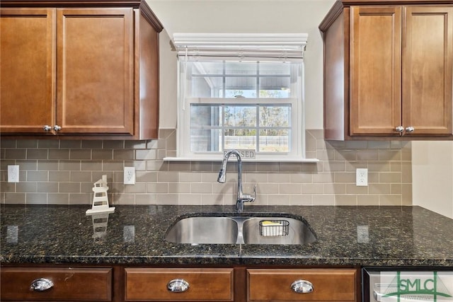 kitchen with a sink, decorative backsplash, wine cooler, and brown cabinets