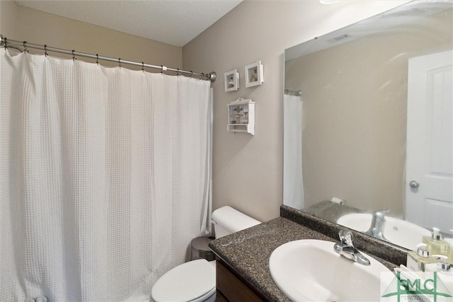 bathroom with visible vents, curtained shower, toilet, and vanity