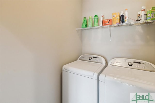 washroom with laundry area and washing machine and dryer