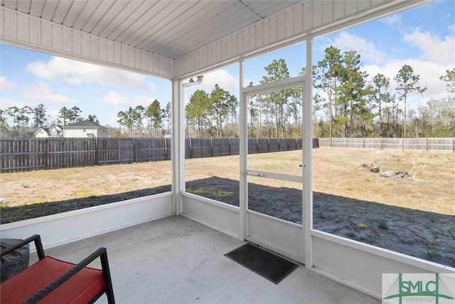 unfurnished sunroom featuring plenty of natural light