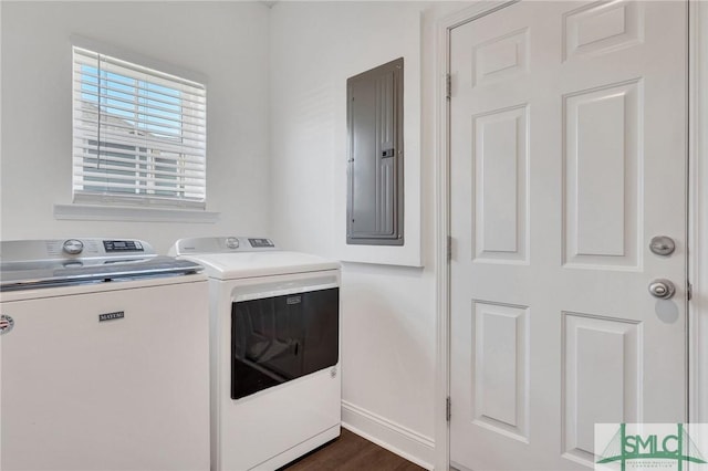 laundry area featuring baseboards, laundry area, electric panel, dark wood-style flooring, and washer and dryer