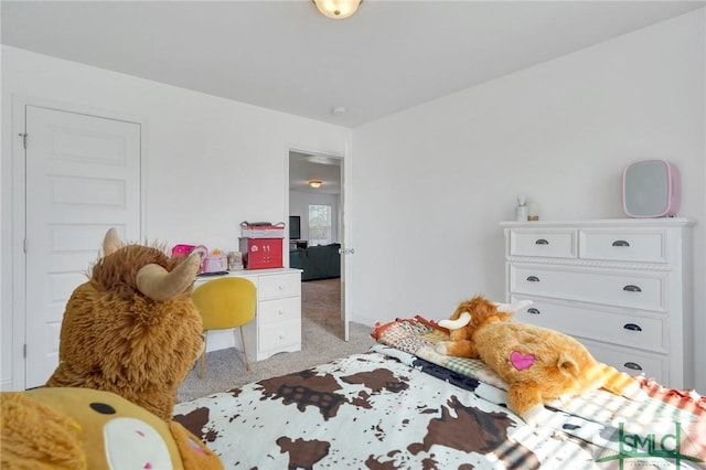 bedroom featuring light colored carpet