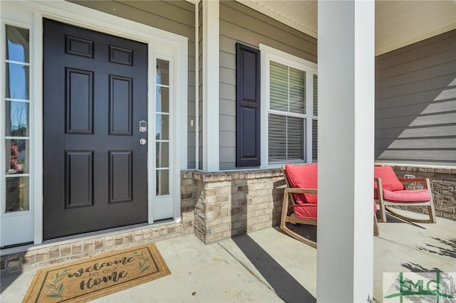 doorway to property with a porch