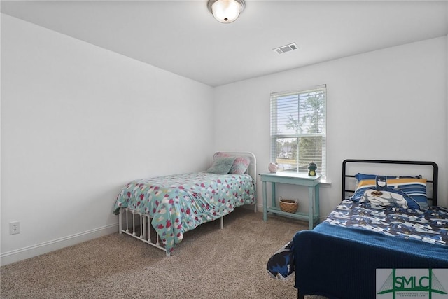 bedroom featuring carpet floors, baseboards, and visible vents