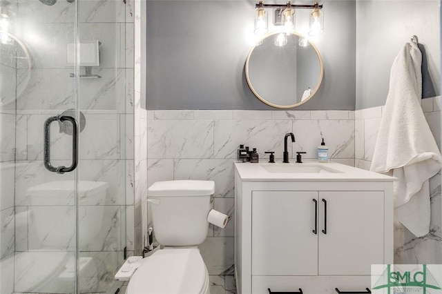 full bathroom with vanity, toilet, and a shower stall