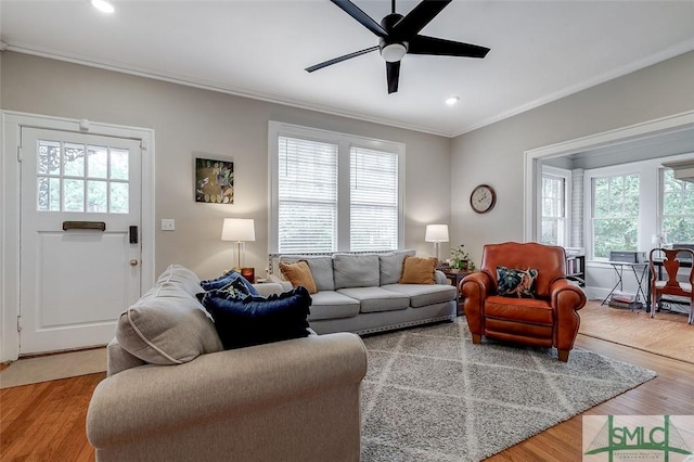 living room with recessed lighting, wood finished floors, ceiling fan, and ornamental molding