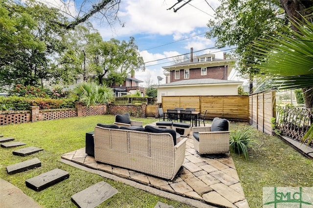 view of yard with a patio area, outdoor lounge area, outdoor dining area, and fence