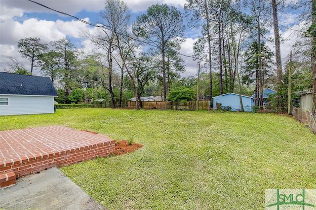 view of yard with a fenced backyard