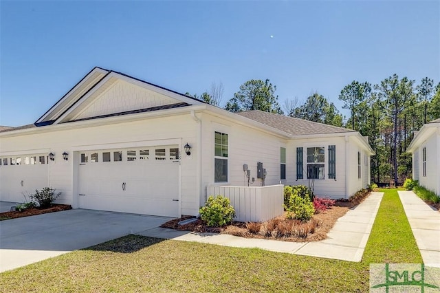 ranch-style home with driveway, a front lawn, and a garage