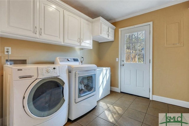 washroom featuring baseboards, light tile patterned flooring, cabinet space, crown molding, and independent washer and dryer