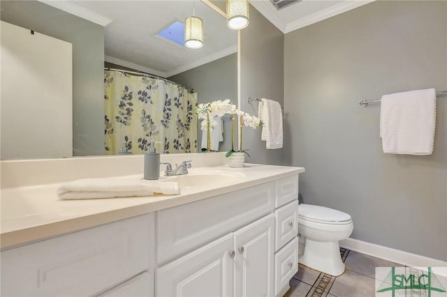 bathroom featuring vanity, baseboards, ornamental molding, tile patterned flooring, and toilet