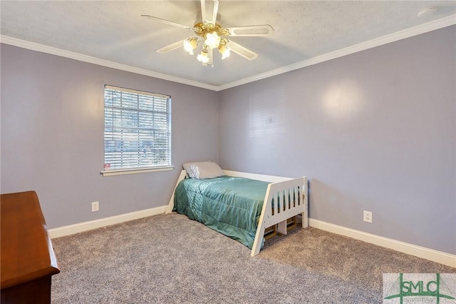 carpeted bedroom with crown molding, baseboards, and ceiling fan