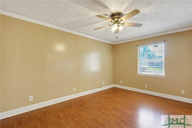 unfurnished room featuring ceiling fan, baseboards, a textured ceiling, and wood finished floors