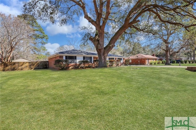 view of yard featuring fence