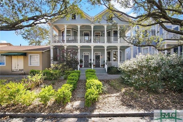 victorian home with covered porch and a balcony