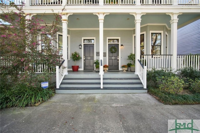 view of exterior entry with a porch