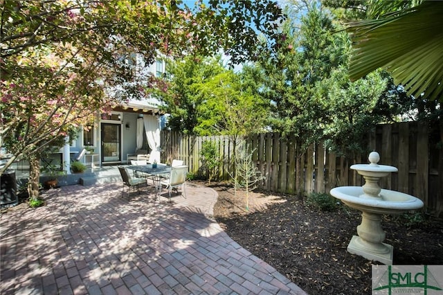 view of patio / terrace featuring outdoor dining space and fence