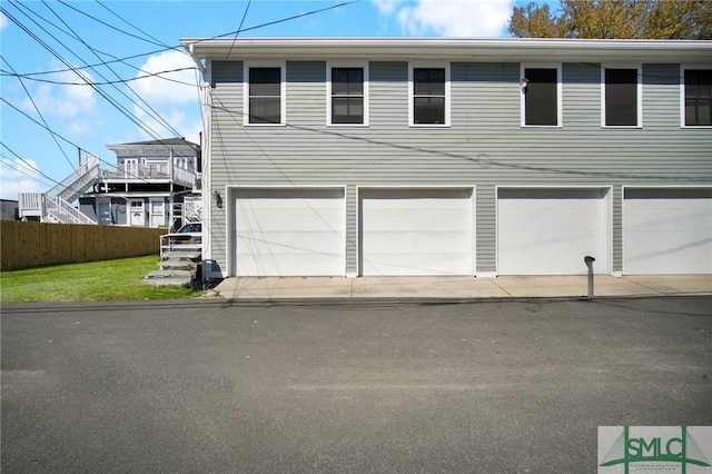 view of front of property featuring fence