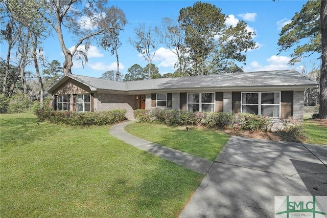 single story home with brick siding and a front yard