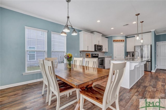 dining space featuring baseboards, visible vents, recessed lighting, ornamental molding, and dark wood-type flooring