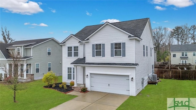 traditional-style home featuring fence, concrete driveway, a front yard, cooling unit, and a garage