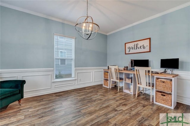 office space with ornamental molding, wood finished floors, a wainscoted wall, and a chandelier