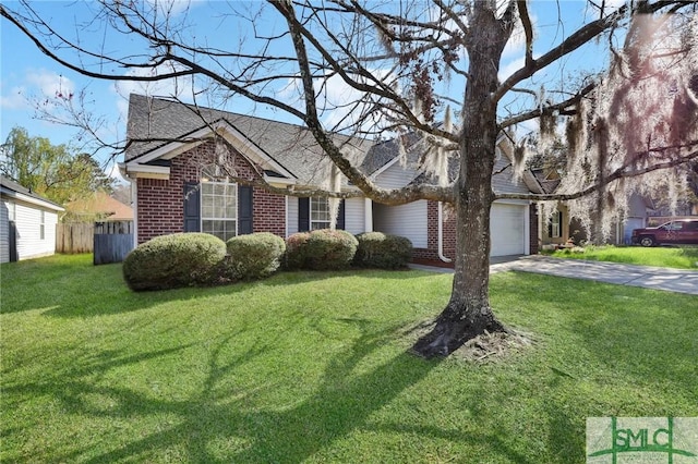 view of front facade with a front lawn, an attached garage, brick siding, and driveway