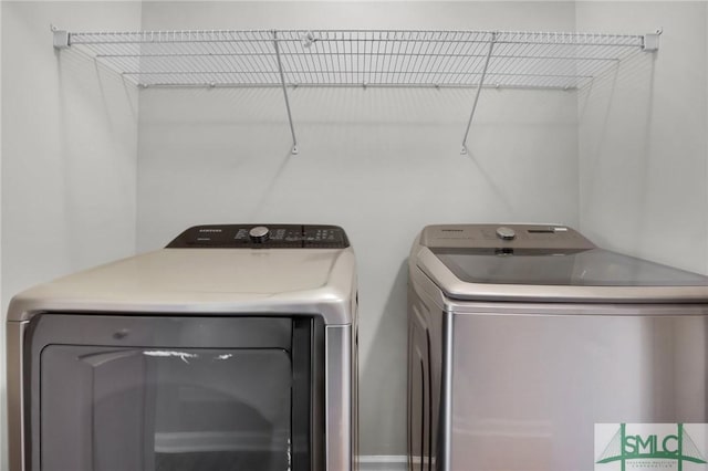 washroom with laundry area and separate washer and dryer