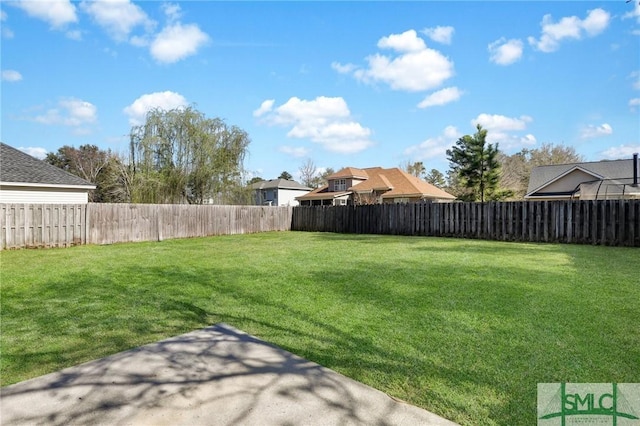 view of yard featuring a fenced backyard