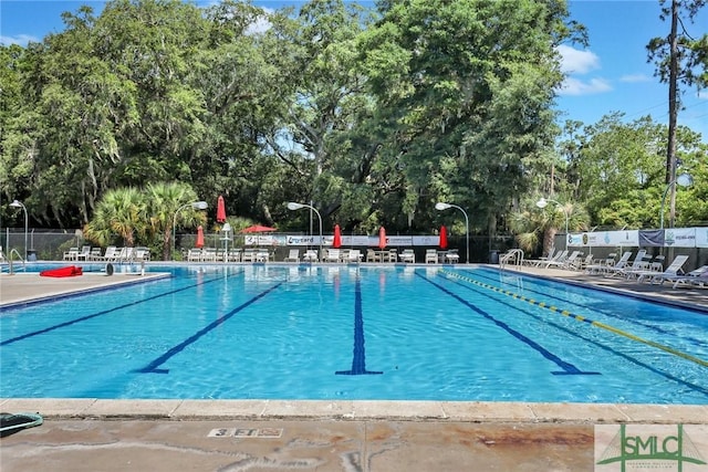 105 Carlton Rd, Savannah, GA 31410 - community pool featuring view of scattered trees and a patio