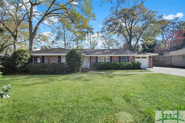 ranch-style house with a front yard, an attached garage, brick siding, and driveway