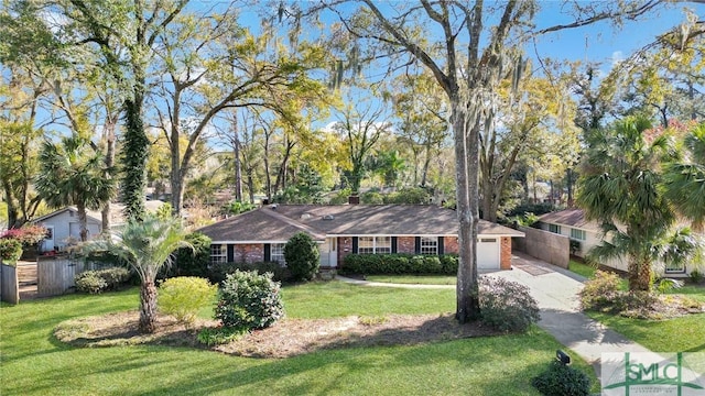 ranch-style house featuring fence, driveway, an attached garage, a front lawn, and brick siding