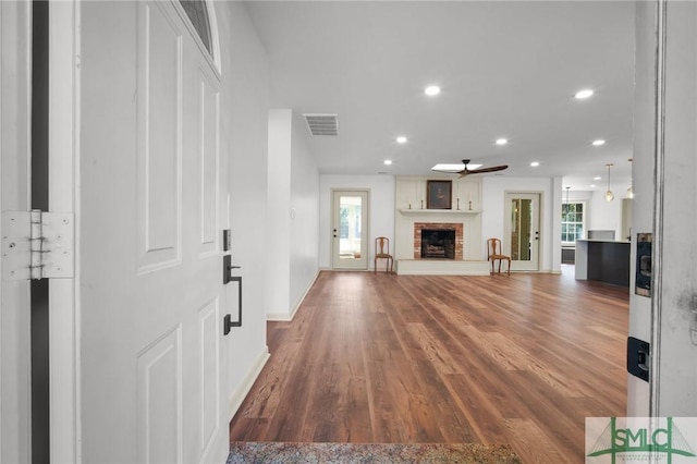 105 Carlton Rd, Savannah, GA 31410 - unfurnished living room featuring a fireplace, ceiling fan, recessed lighting, and wood finished floors