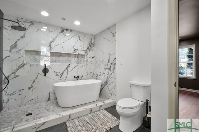 105 Carlton Rd, Savannah, GA 31410 - bathroom featuring a freestanding tub, a marble finish shower, tile walls, and recessed lighting