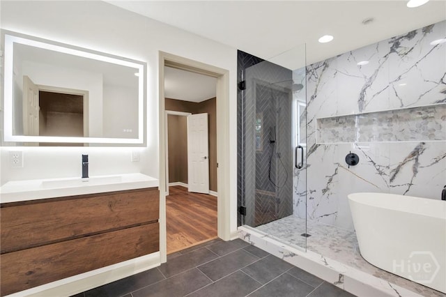 105 Carlton Rd, Savannah, GA 31410 - bathroom with a marble finish shower, vanity, a soaking tub, tile patterned flooring, and recessed lighting