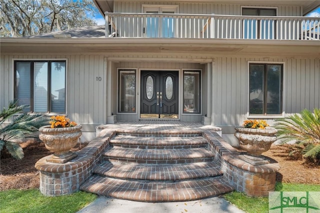 doorway to property featuring a balcony