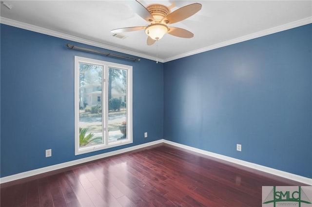 unfurnished room with baseboards, wood finished floors, visible vents, and ornamental molding