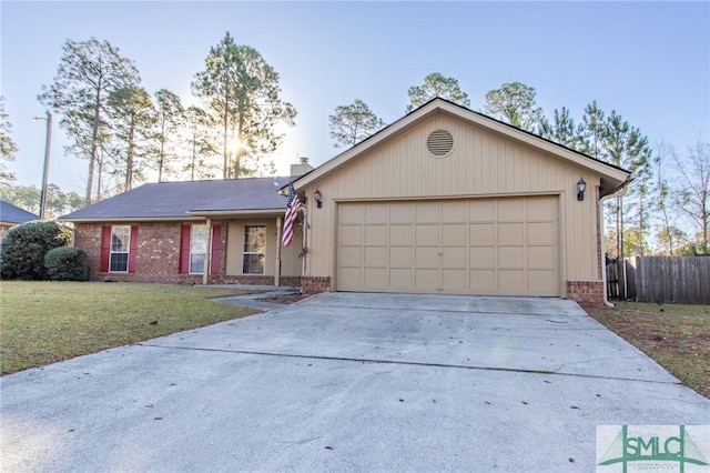 ranch-style home featuring a front yard, fence, brick siding, and driveway