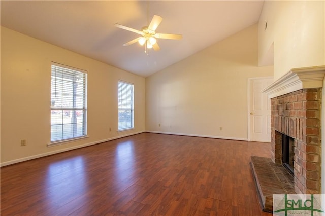 unfurnished living room with baseboards, a ceiling fan, dark wood-style floors, and a fireplace