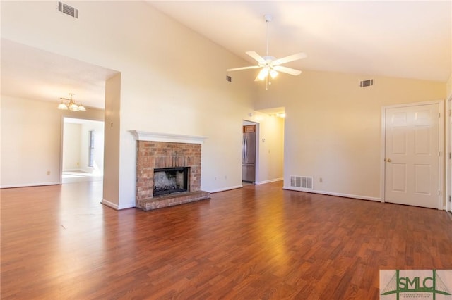 unfurnished living room featuring dark wood-type flooring, a fireplace, and visible vents