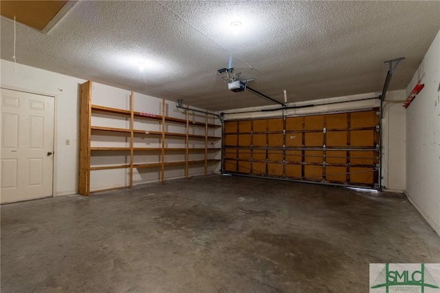 garage featuring a garage door opener and baseboards