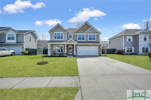 view of front facade with a garage, concrete driveway, a front yard, and fence